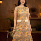 Summery mustard and peach floral sleeveless dress featuring a boat neckline and Hakoba pocket detailing, finished with soft off-white accents for a breezy, cheerful silhouette perfect for warm days.