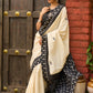 Ivory cotton saree with bold block embroidered motifs and refined contrast detailing