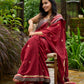 Artisanal maroon Jamdani saree elevated with zari-bordered detailing