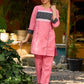 Vibrant pink short kurta elevated with a handcrafted black ikat neckline accent and folded cuffs.