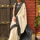 Ivory cotton saree with bold block embroidered motifs and refined contrast detailing