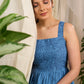 Flowy blue cotton dress with intricate block print and artistic detailing