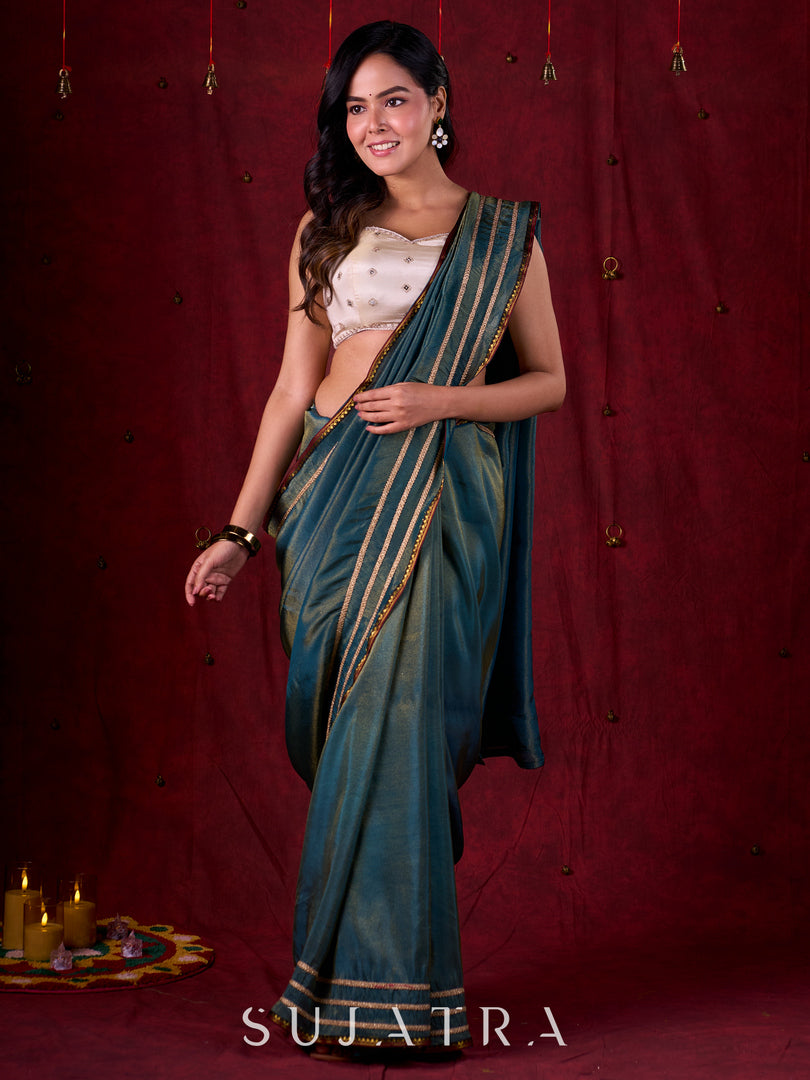 Teal Blue Tissue Saree with Zari Border & Minimal Detailing