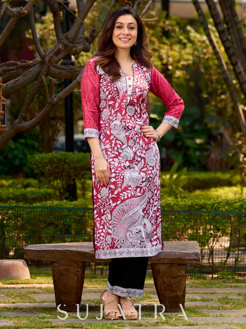 Rich mulberry pink kurta showcasing all-over Kalamkari print with balanced white and black accents