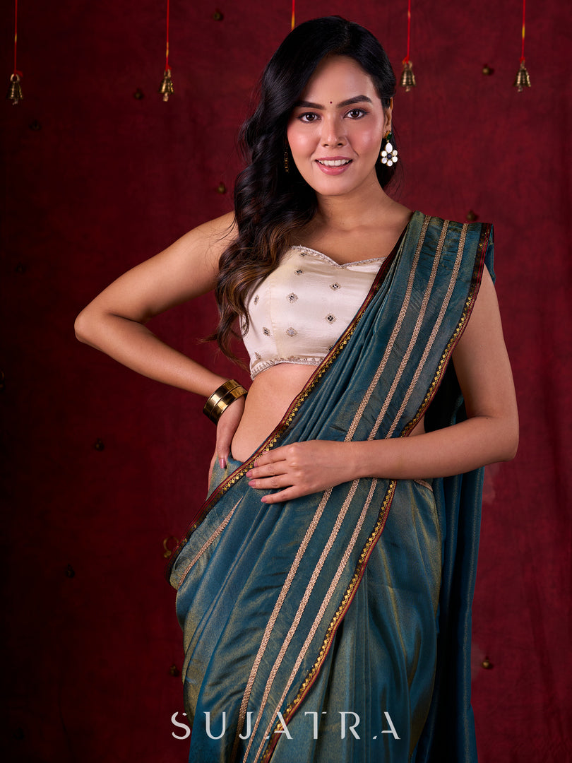 Teal Blue Tissue Saree with Zari Border & Minimal Detailing