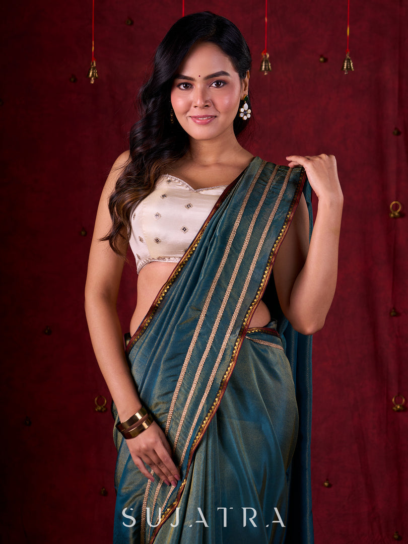 Teal Blue Tissue Saree with Zari Border & Minimal Detailing