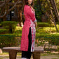 Rich mulberry pink kurta showcasing all-over Kalamkari print with balanced white and black accents