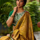 Exquisite Mustard Bandhani Print Saree with Green Benarasi Border & Tasseled Pallu with Hand Embroidered Mirror Work