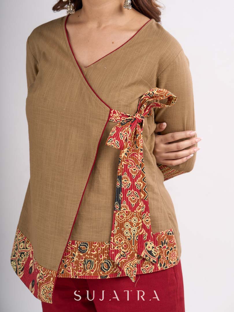 Beige Cotton Angrakha Style Top with Contrast Piping and Statement Tie Up Detailing