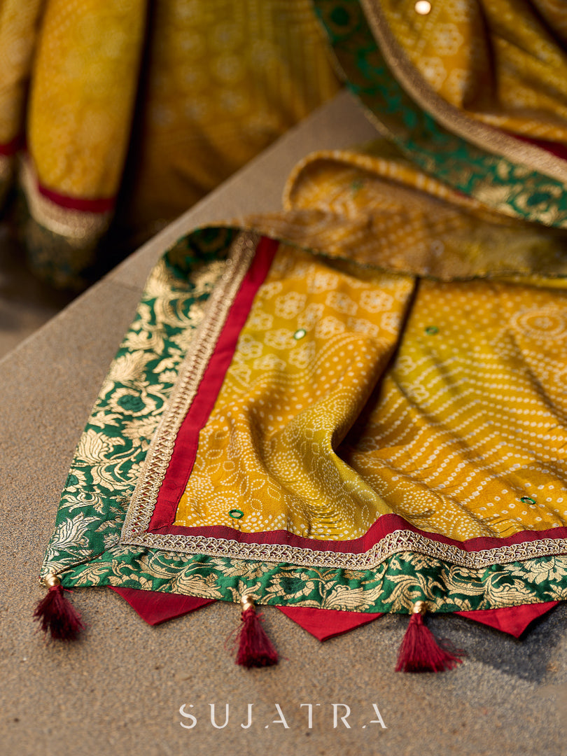 Exquisite Mustard Bandhani Print Saree with Green Benarasi Border & Tasseled Pallu with Hand Embroidered Mirror Work