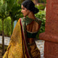 Exquisite Mustard Bandhani Print Saree with Green Benarasi Border & Tasseled Pallu with Hand Embroidered Mirror Work
