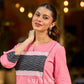Vibrant pink short kurta elevated with a handcrafted black ikat neckline accent and folded cuffs.