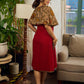 Elegant maroon dress featuring an attached artisan Kalamkari shoulder cape.