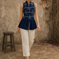 Contemporary indigo top with delicate dragonfly motifs, high folded collar, and graceful pleated hemline.