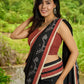 Heritage black cotton saree blending Jamdani-inspired weaves with Ajrakh elegance