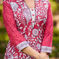 Rich mulberry pink kurta showcasing all-over Kalamkari print with balanced white and black accents