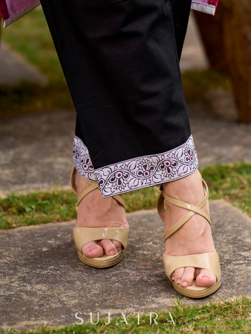 Rich mulberry pink kurta showcasing all-over Kalamkari print with balanced white and black accents