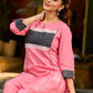 Vibrant pink short kurta elevated with a handcrafted black ikat neckline accent and folded cuffs.