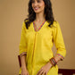 Traditional madhubani hand painting enhances this bright yellow cotton top.