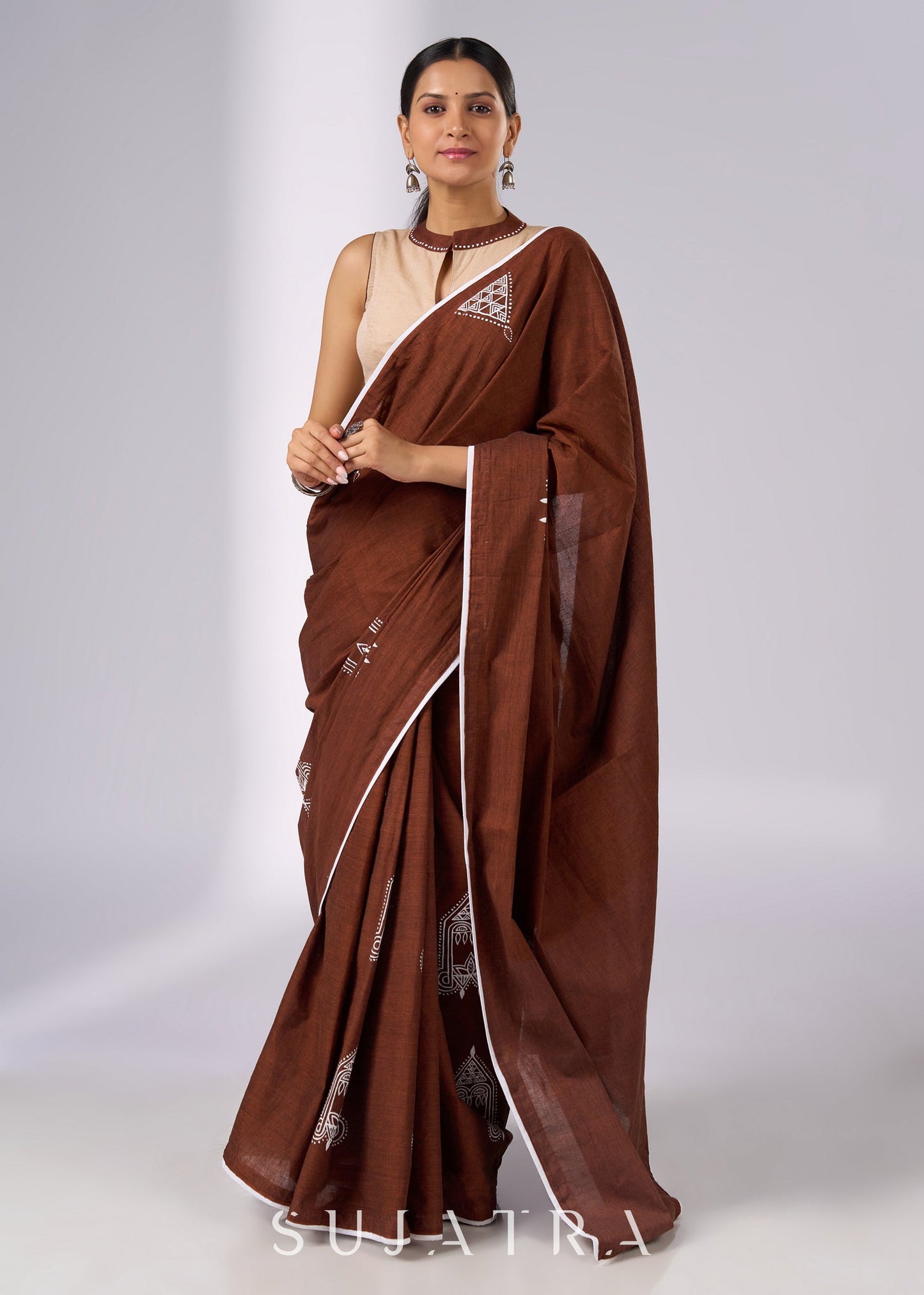 Minimalist brown cotton saree with sophisticated hand painting motifs