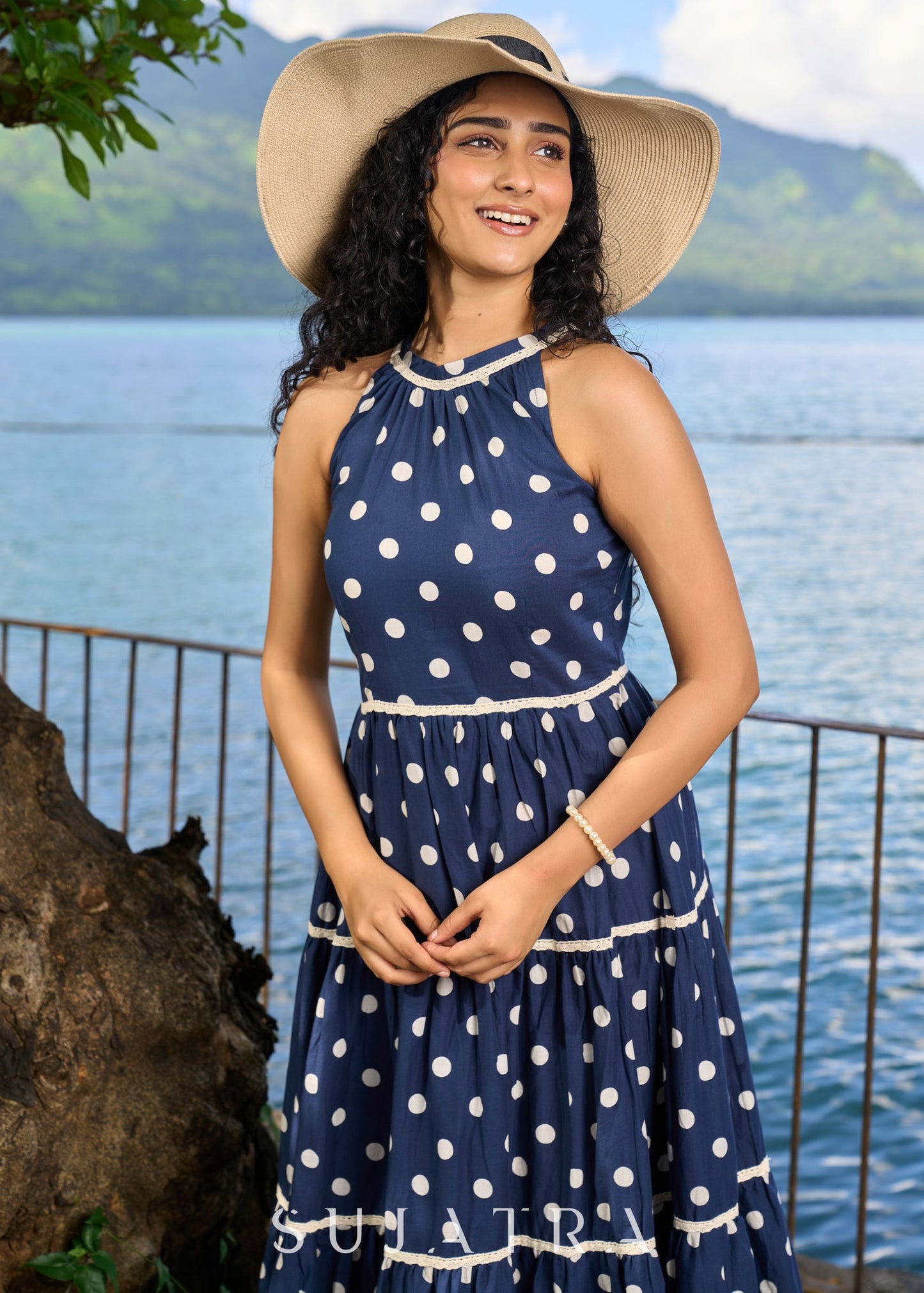Trendy navy blue cotton polka dot halter neck dress highlighted with macrame lace