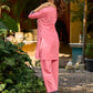 Vibrant pink short kurta elevated with a handcrafted black ikat neckline accent and folded cuffs.