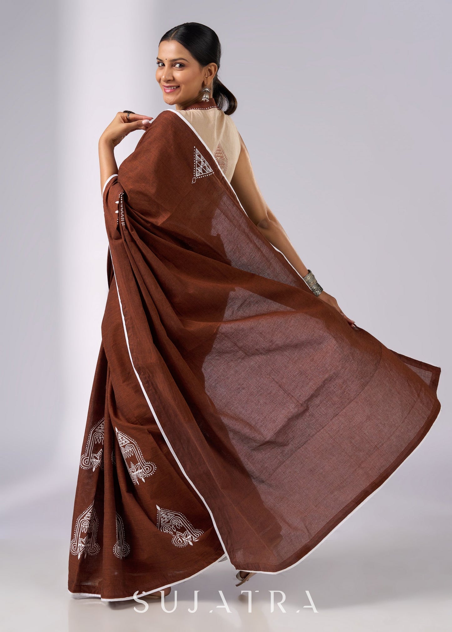 Minimalist brown cotton saree with sophisticated hand painting motifs