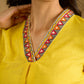 Traditional madhubani hand painting enhances this bright yellow cotton top.