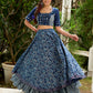 Modern folkloric layered indigo lehenga beautifully contrasted with a luminous full mirror work choli - Lehriya dupatta optional.