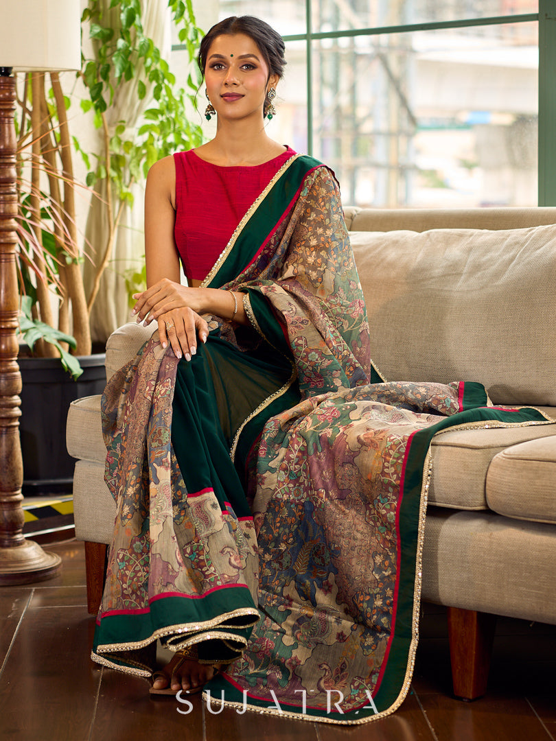 Regal Bottle Green Georgette Saree with Artistic Kalamkari Printed Pallu & Delicate Gold Lace Border