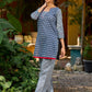 chic indigo short kurta featuring a floral stripe fusion and vibrant red piping.