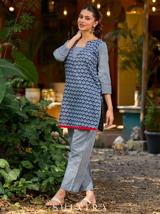 chic indigo short kurta featuring a floral stripe fusion and vibrant red piping.