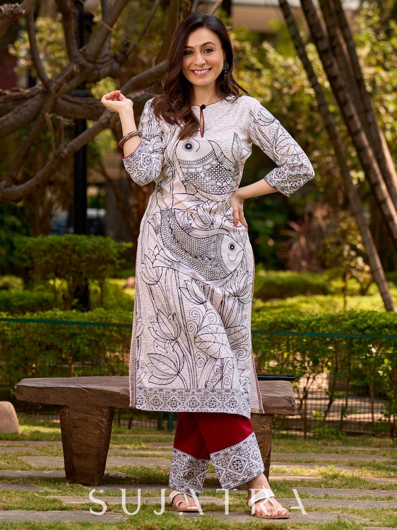 Elegant off-white and black kurta featuring Madhubani fish motifs with rich maroon accents