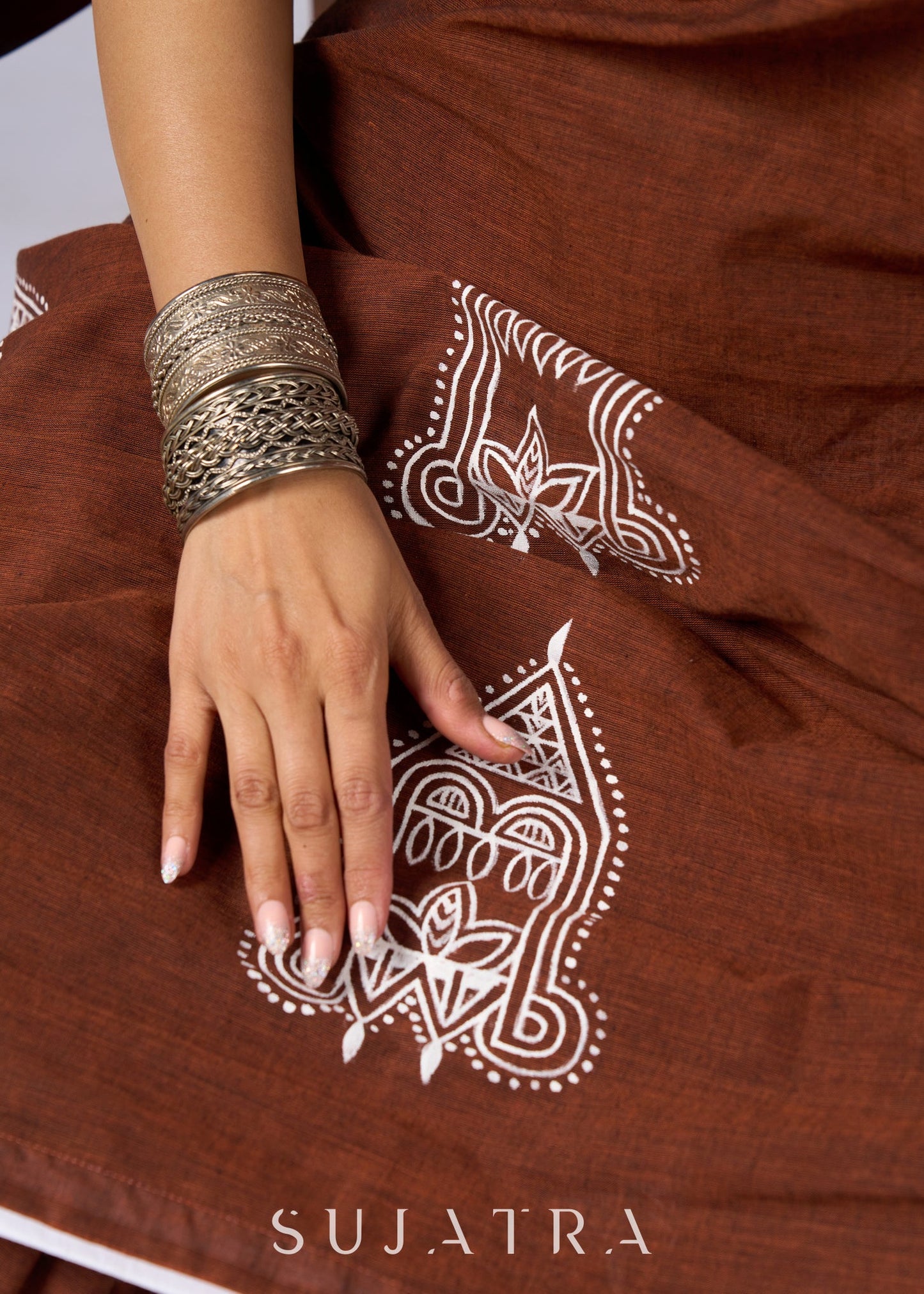 Minimalist brown cotton saree with sophisticated hand painting motifs