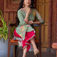 Soft green printed kurta with vibrant floral motifs, highlighted with hand embroidery and bright magenta accents.