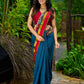 Elegant striped cotton saree in teal, enriched with hand-painted Kalamkari pallu
