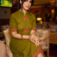 Gorgeous olive dress with pink abstract triangle hand block prints placed at the centre, sleeves, and back, featuring a mandarin collar and half sleeves for a refined, contemporary look.
