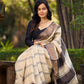Classic Ivory and Brown Pure Tussar Silk  Block Printed Saree Accented with Subtle Stripes and Handcrafted Detailing
