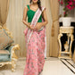 Blush pink floral fantasy chanderi saree draped with embroidered border