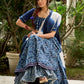 Modern folkloric layered indigo lehenga beautifully contrasted with a luminous full mirror work choli - Lehriya dupatta optional.