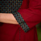 Chic maroon dress featuring a contrasting teal neck patch with charming Peter Pan collar details