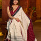 Classic ivory cotton saree adorned with Jamdani-inspired woven motifs