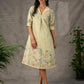 Soft green Kalamkari printed collared dress with centre pleat detailing.