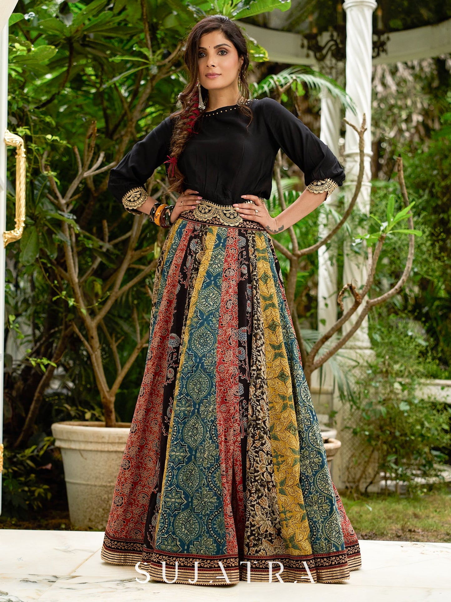 Modern colourful Ajrakh lehenga beautifully contrasted by a sleek black gathered topwear.