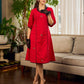 Elegant red dress featuring delicate, hand-painted Madhubani lotus motif detailing.