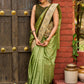 Pastel green semi-silk saree featuring Madhubani artwork on pallu and border