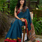 Elegant striped cotton saree in teal, enriched with hand-painted Kalamkari pallu