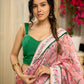 Blush pink floral fantasy chanderi saree draped with embroidered border
