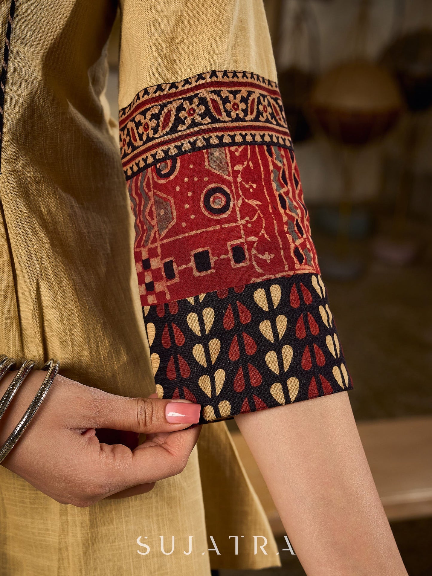 Chic Beige Cotton Top Enhanced With Ajrakh Print Sleeves And An Embellished Mirror Work Yoke