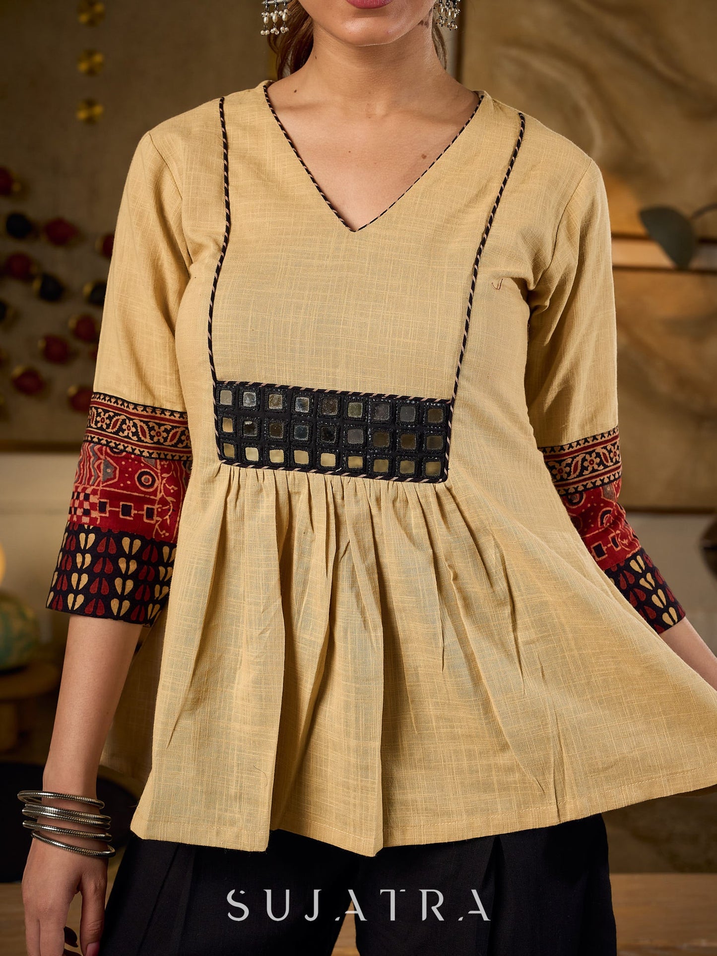Chic Beige Cotton Top Enhanced With Ajrakh Print Sleeves And An Embellished Mirror Work Yoke
